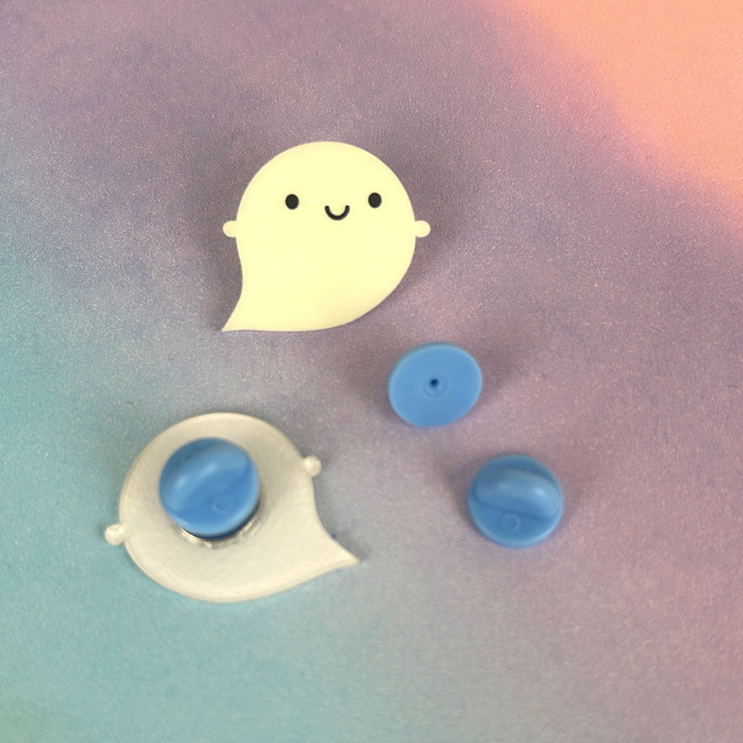 3 rubber clutch backs showing all sides and how they connect to an acrylic ghost pin