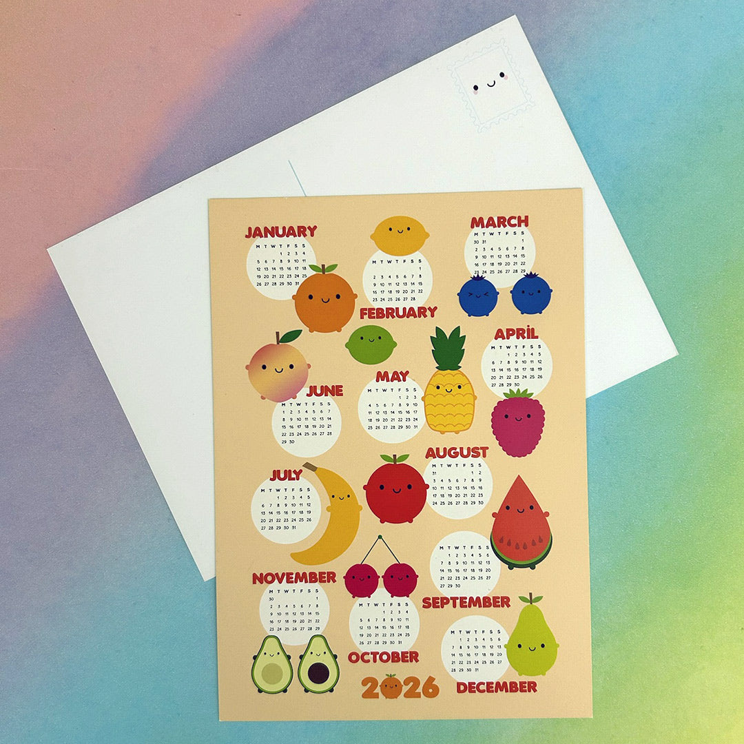 Calendar postcards on a colourful gradient background. Shows the front with fruit designs for each month of 2026 and the reverse with a standard postcard layout and illustrated kawaii stamp.