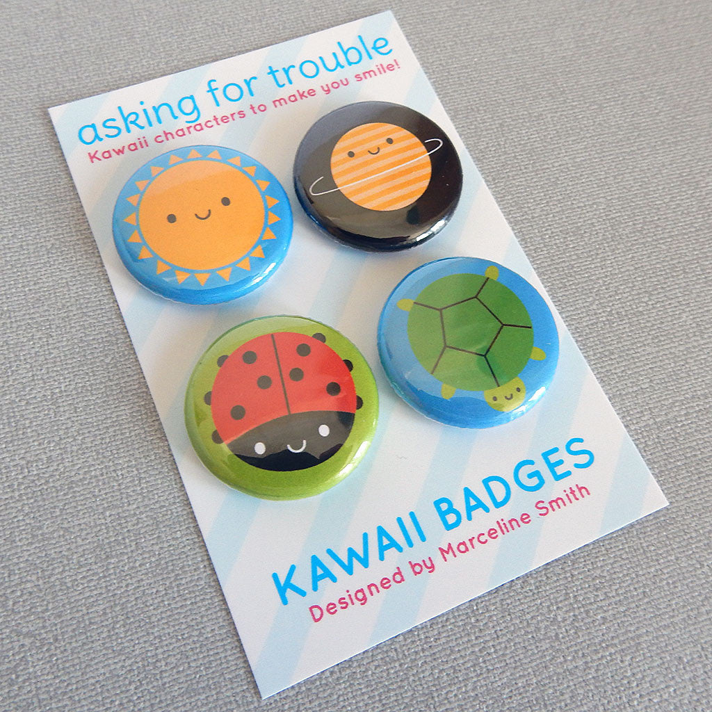 Badges are packaged on a striped backing card