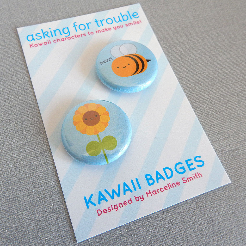 Badges are packaged on a striped backing card