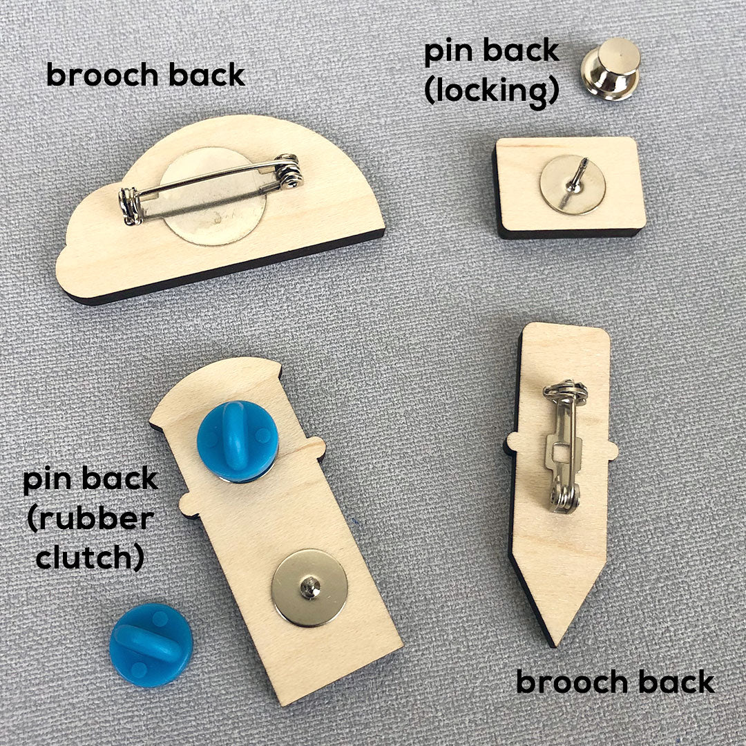 Examples of a brooch back, pin back, rubber clutch and locking back