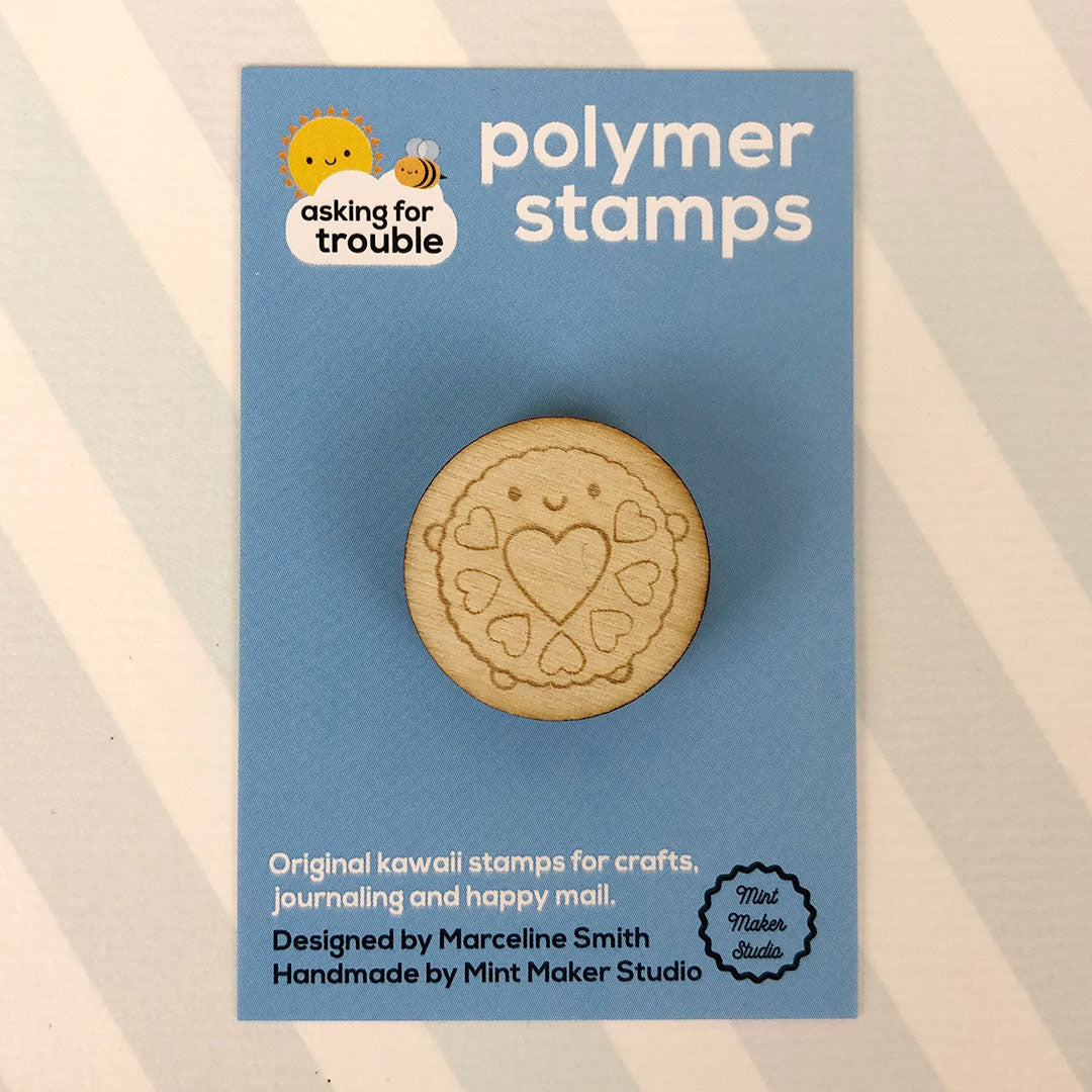 The polymer stamp on an illustrated backing card