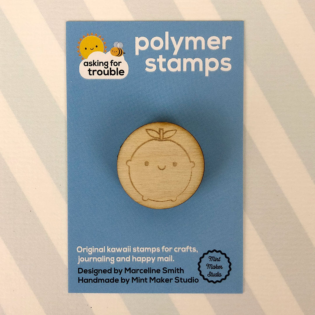 The polymer stamp on an illustrated backing card