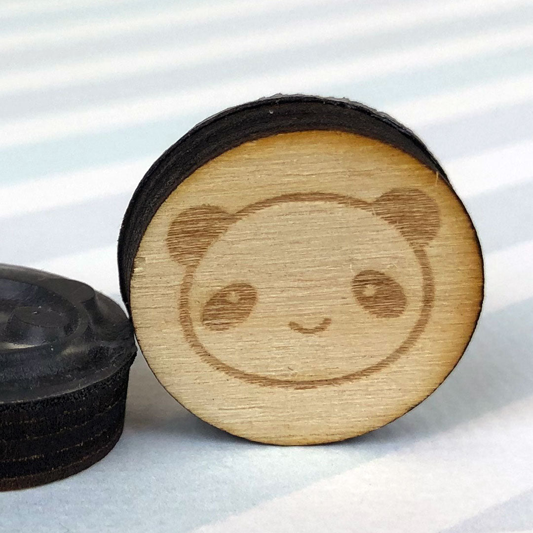 Close up of 2 Panda stamps showing the laser engraving and height