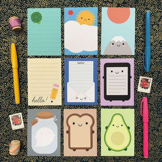 All 9 mini memo sheets laid out in a square with pens, stamps and washi tape