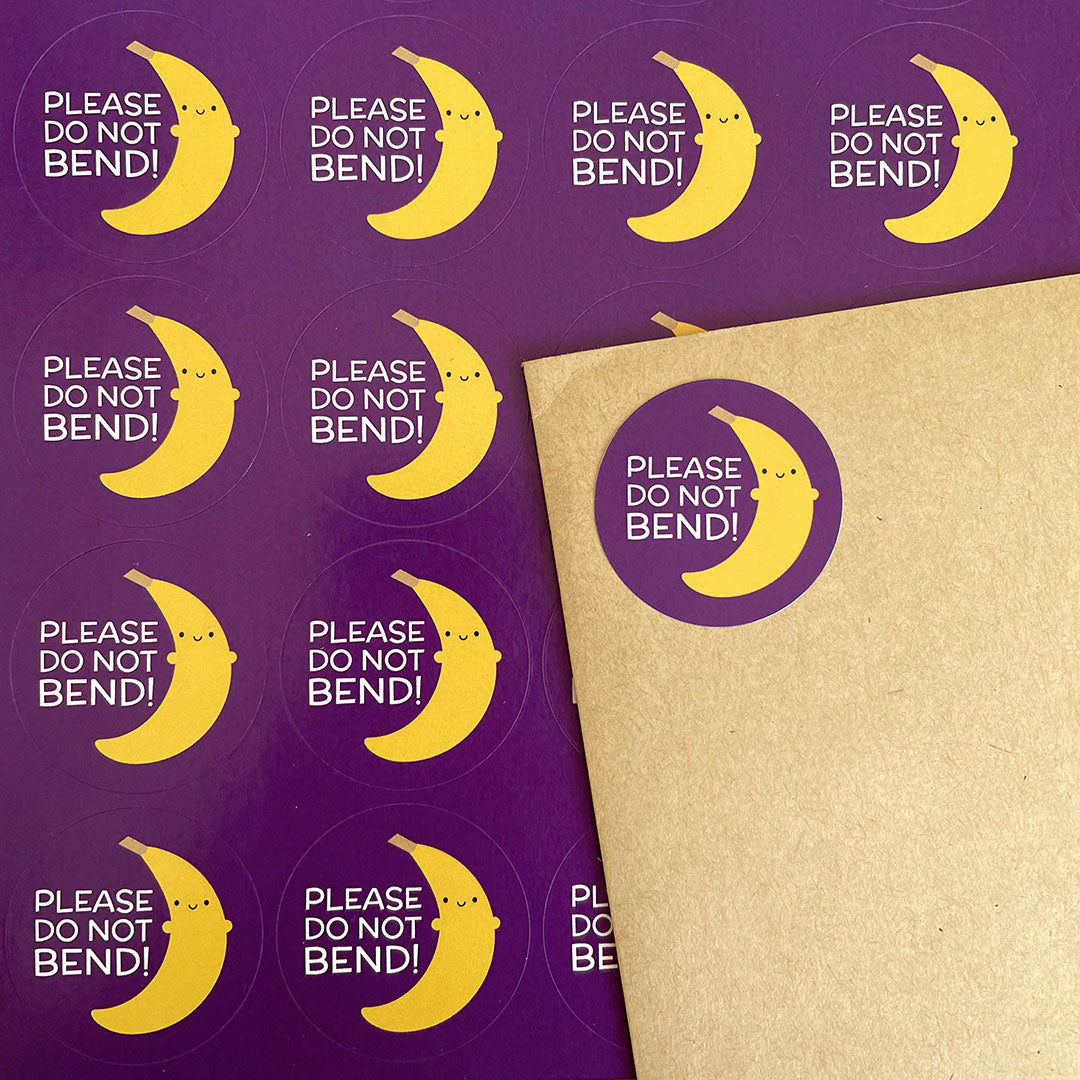 A sheet of Do Not Bend stickers and one decorating an envelope