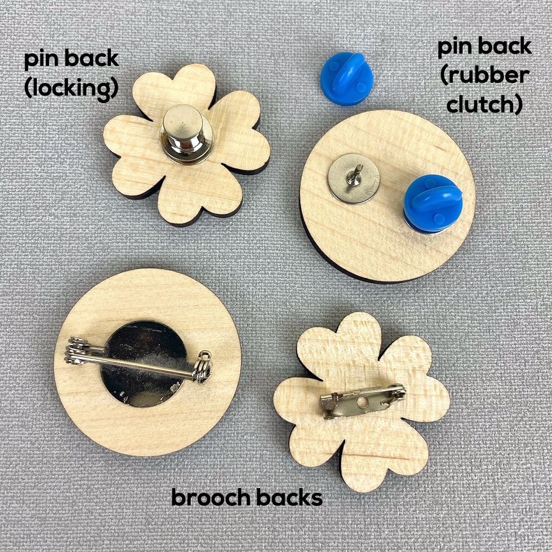 Examples of a brooch back, pin back, rubber clutch and locking back