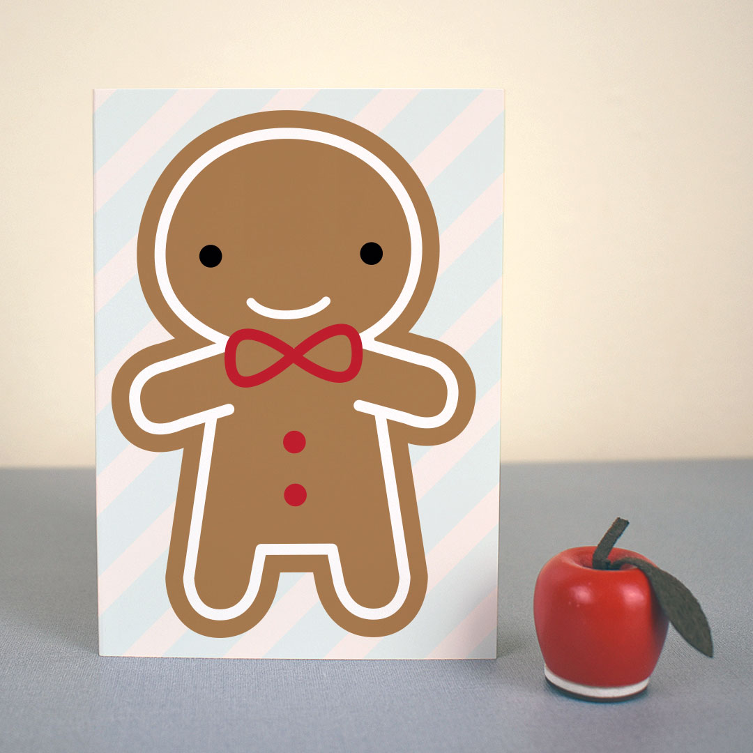 The card standing up with a small apple figure
