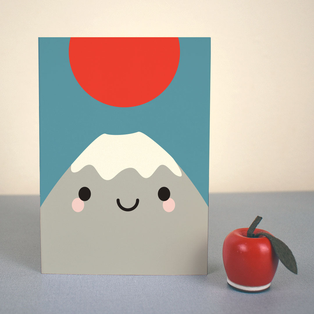 The card standing up with a small apple figure