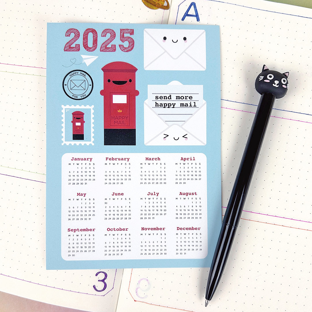 The calendar postcard on a journal with a pen