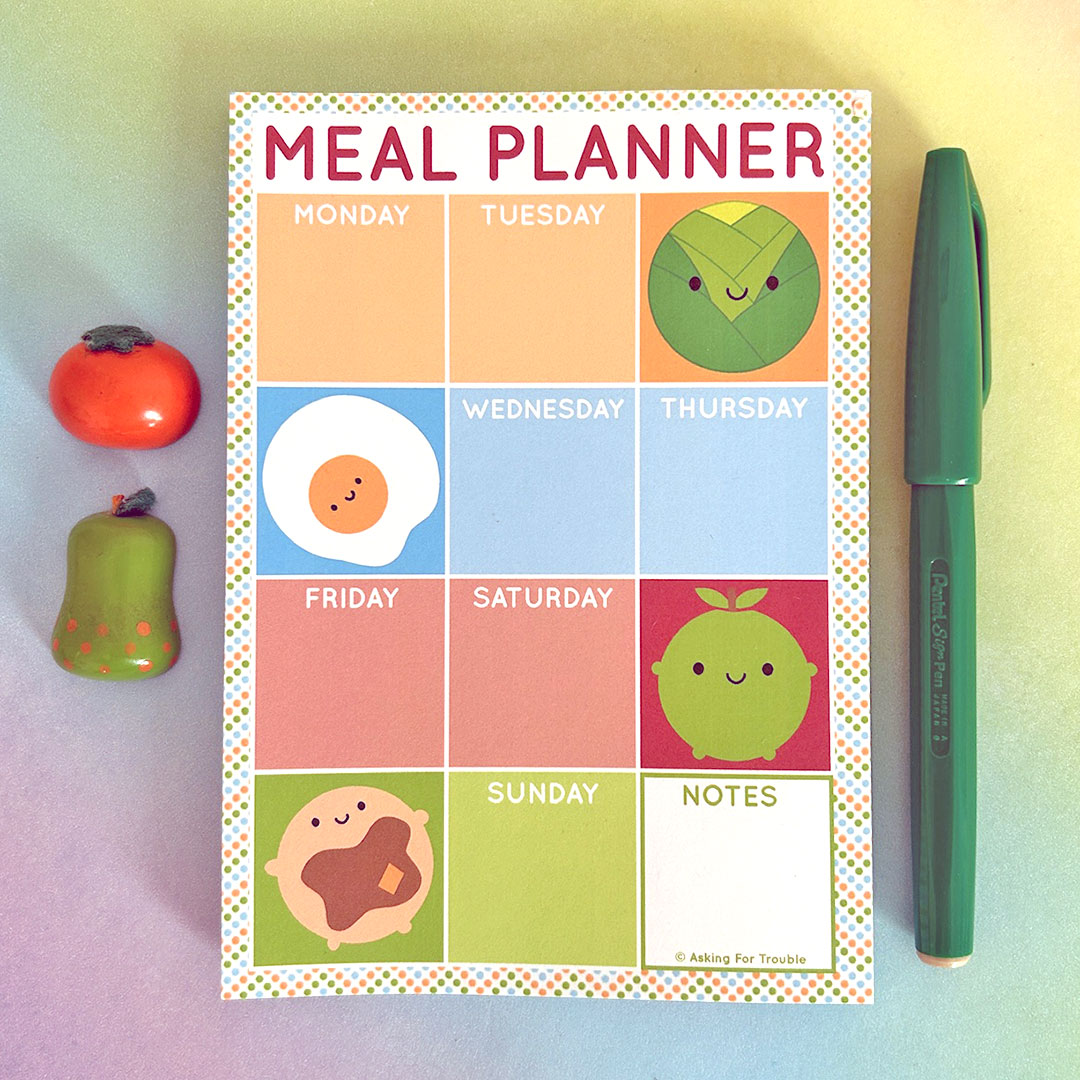 Meal planner notepad with colourful squares for each day of the week and kawaii food characters