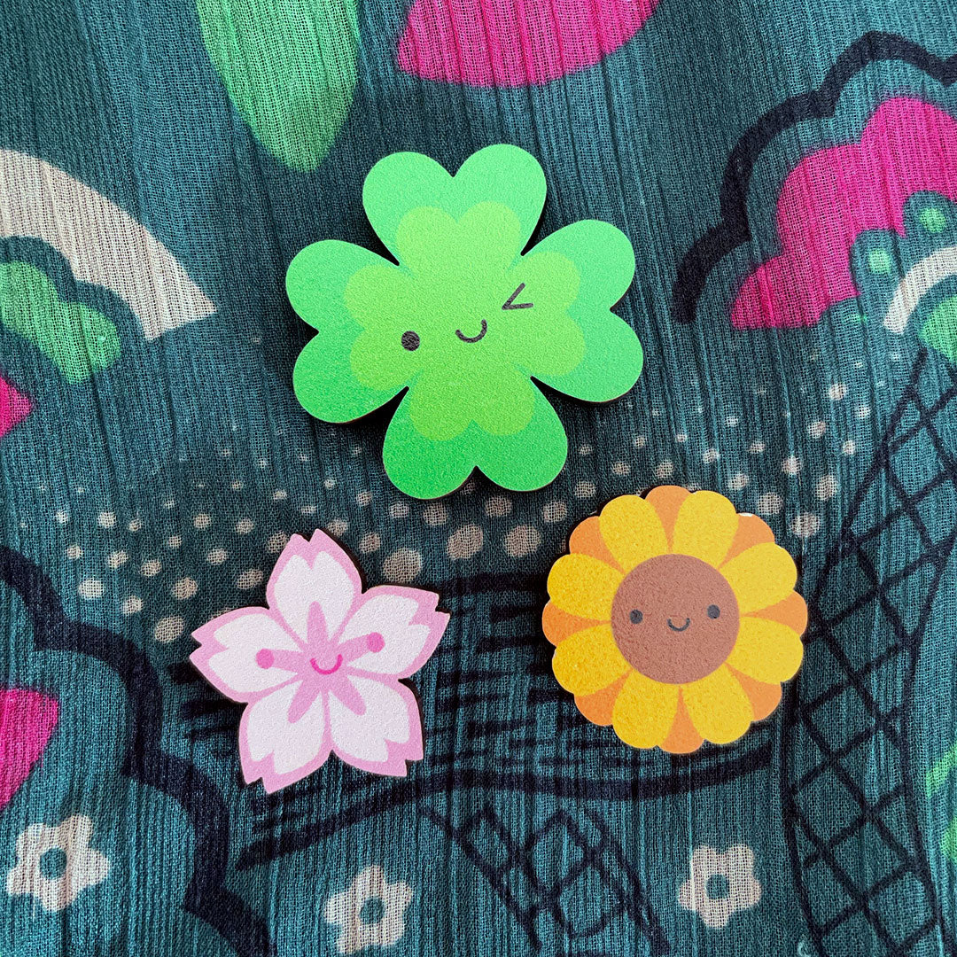 Lucky clover, sakura and sunflower pins together