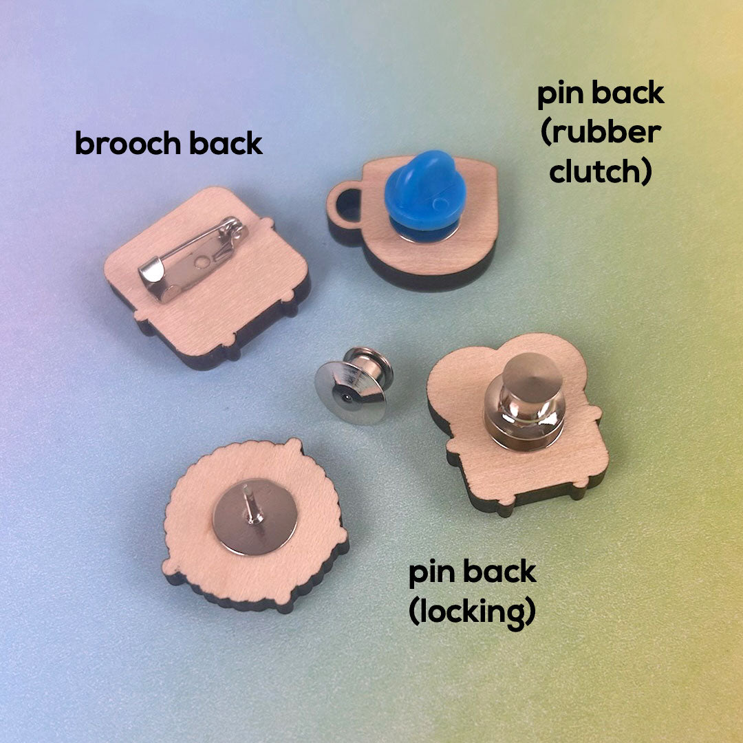 Examples of a brooch back, pin back, rubber clutch and locking back