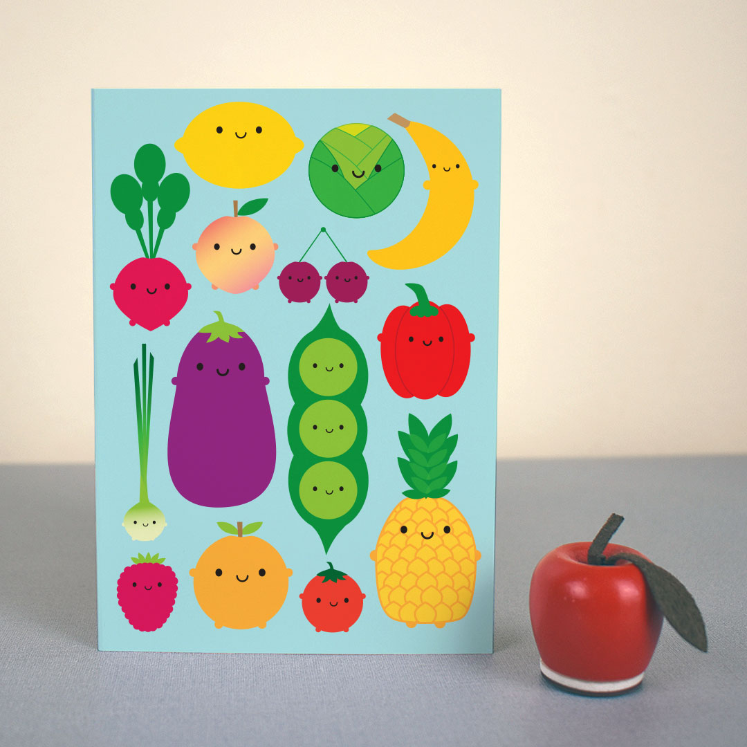The card standing up with a small apple figure