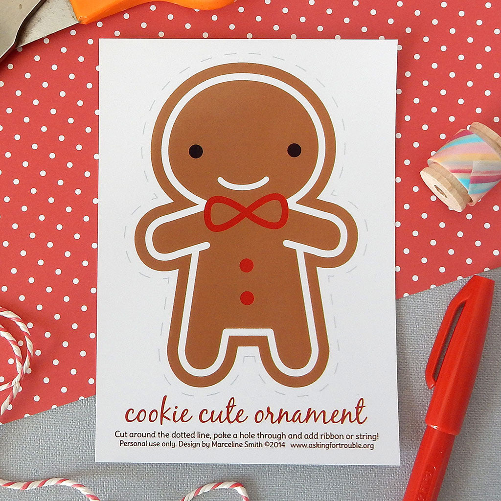 An illustrated postcard with a happy gingerbread man that can be cut out