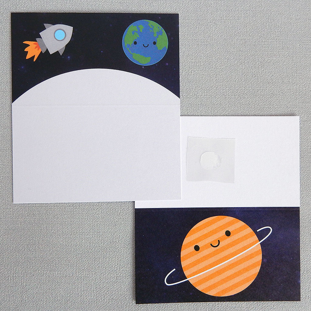 Two Solar System gift tags showing the front and inside illustrations of happy planet, Earth and rocket