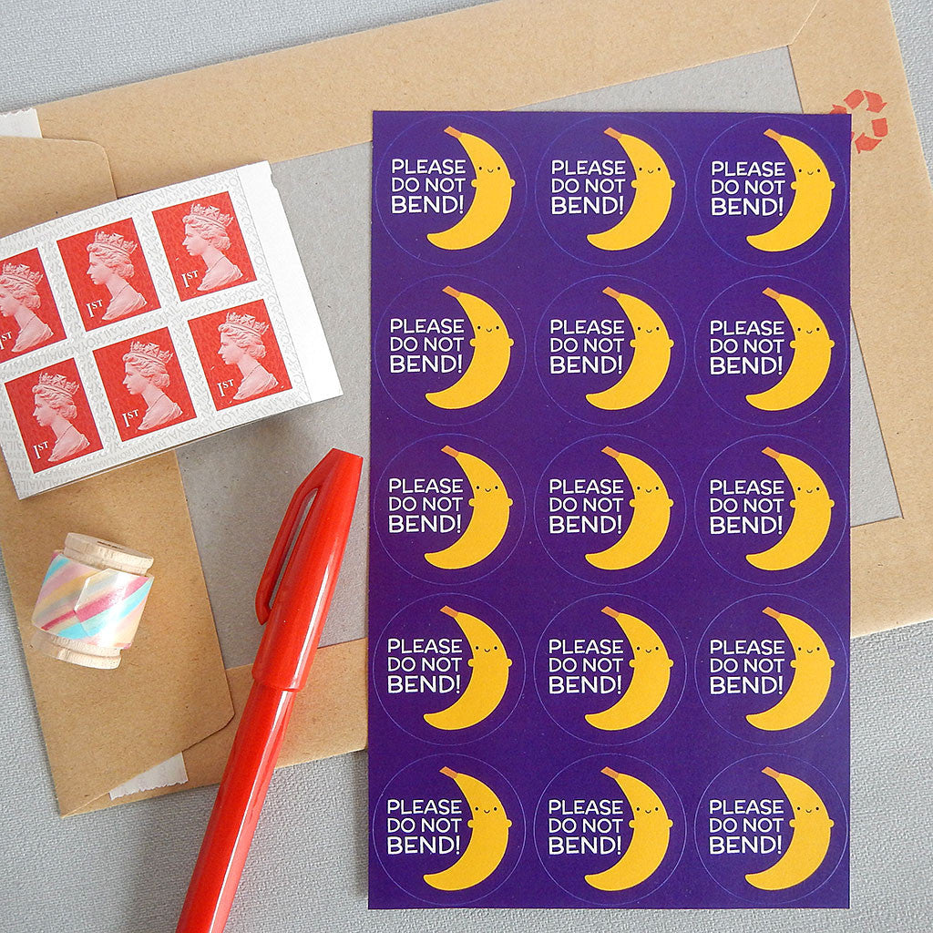 A sheet of Do Not Bend stickers with envelope, stamps, pen and washi tape