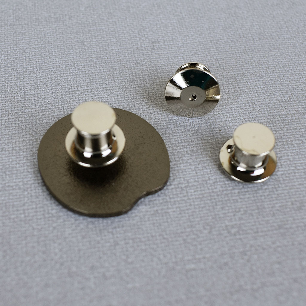 3 metal locking backs showing all sides and how they connect to a pin
