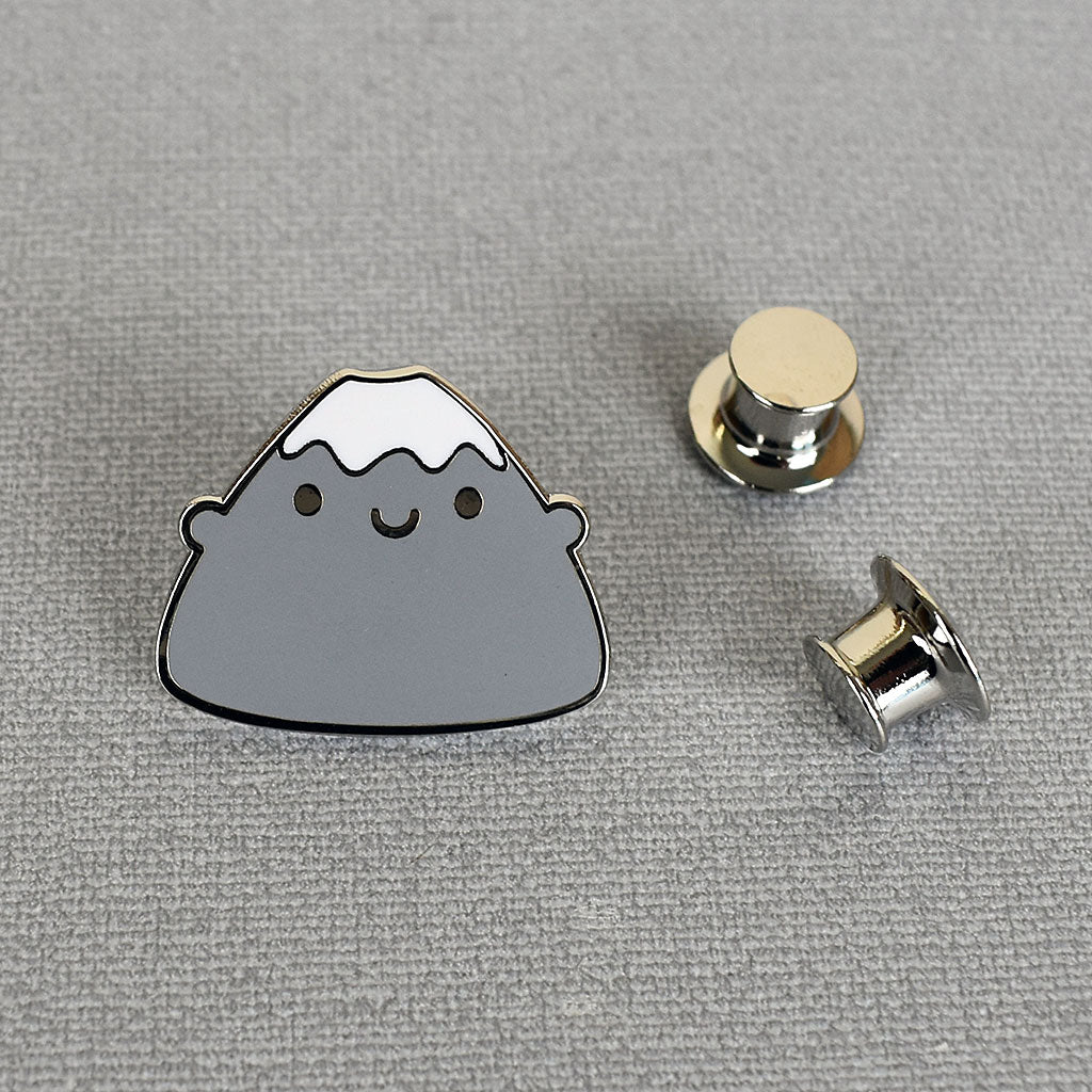 A Mt Fuji enamel pin with 2 locking backs