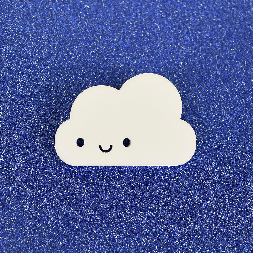 A kawaii Happy Cloud brooch laser cut from white acrylic (with open eyes)