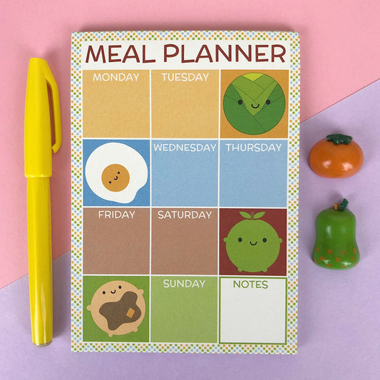 Meal planner notepad with colourful squares for each day of the week and kawaii food characters