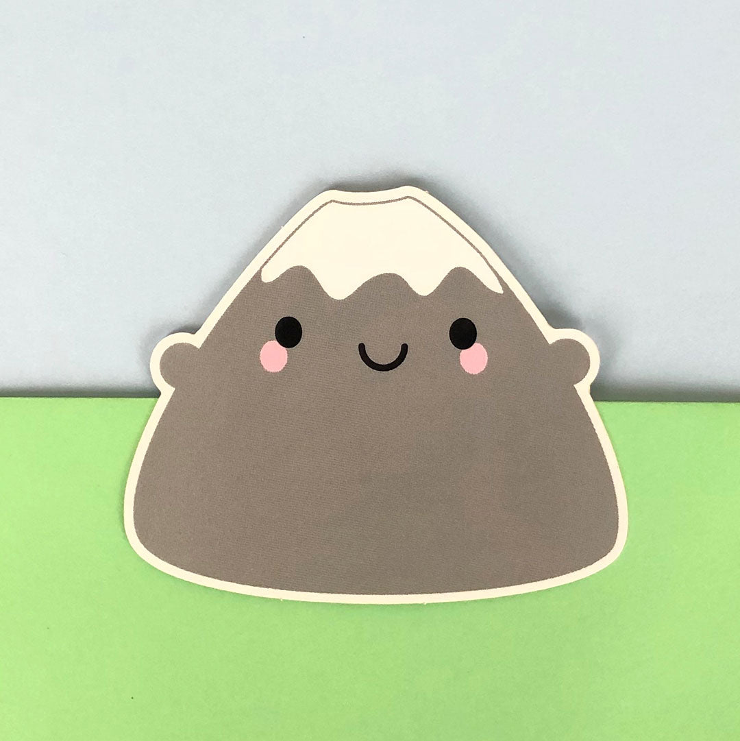 A die cut vinyl sticker of a happy Mt Fuji