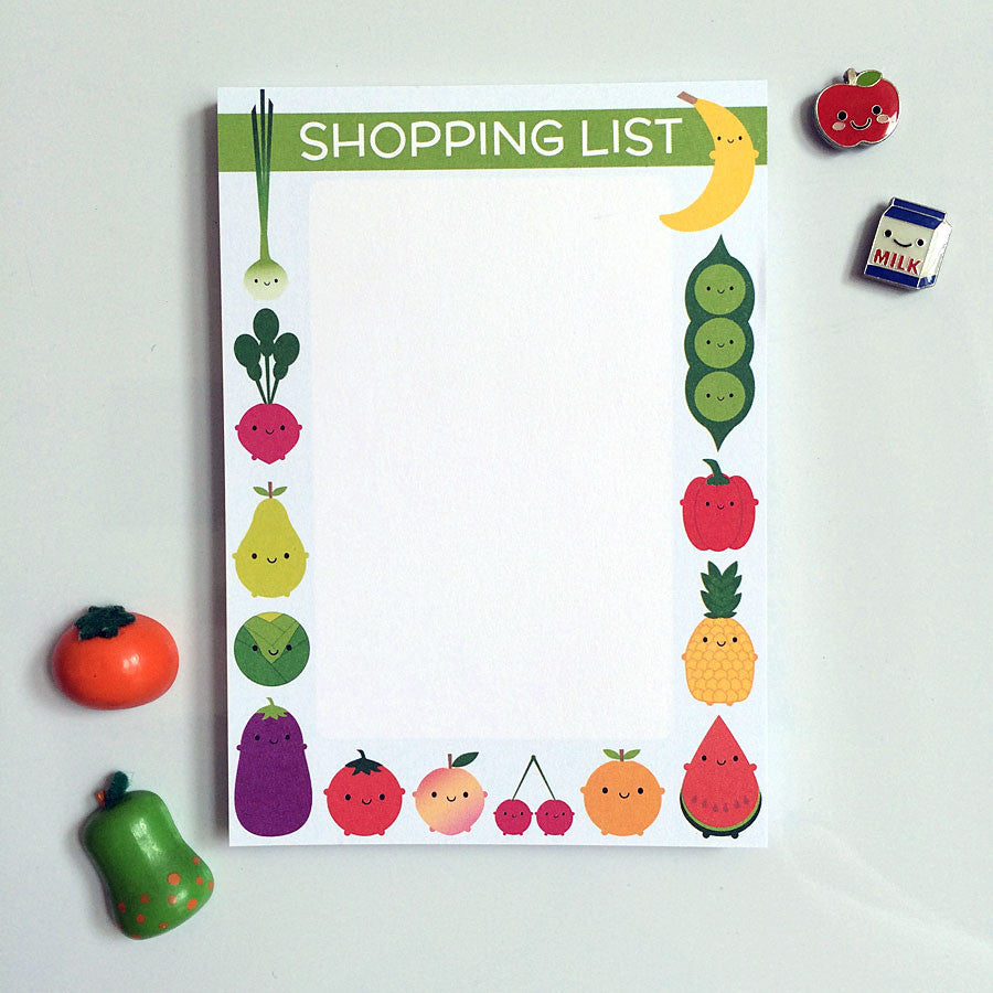 Shopping list notepad with a border of kawaii food characters surrounded by cute fridge magnets
