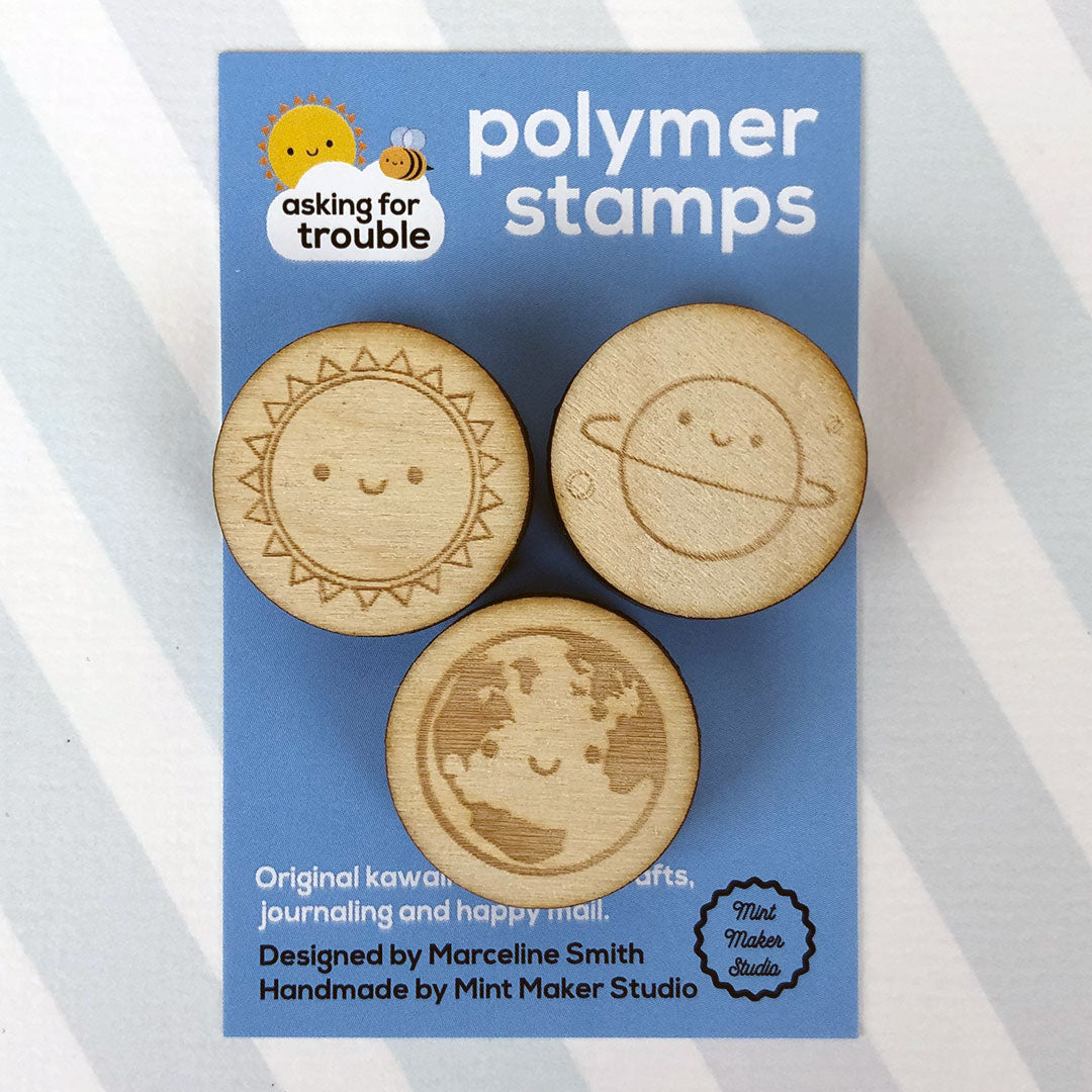 The 3 stamps together on an illustrated backing card