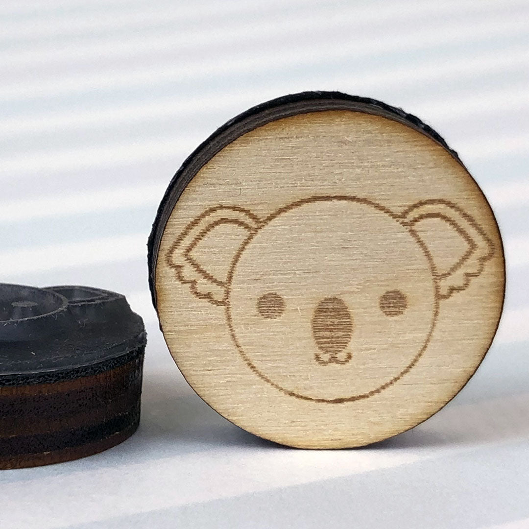 Close up of 2 Koala stamps showing the laser engraving and height