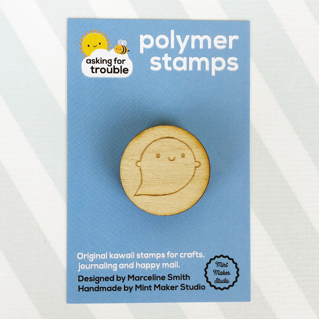 The polymer stamp on an illustrated backing card