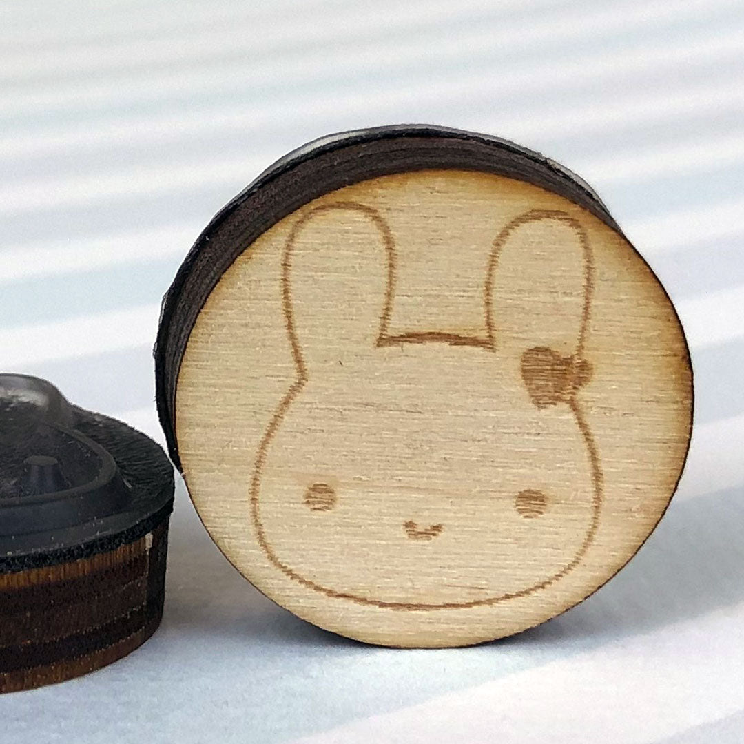 Close up of 2 Bunny stamps showing the laser engraving and height