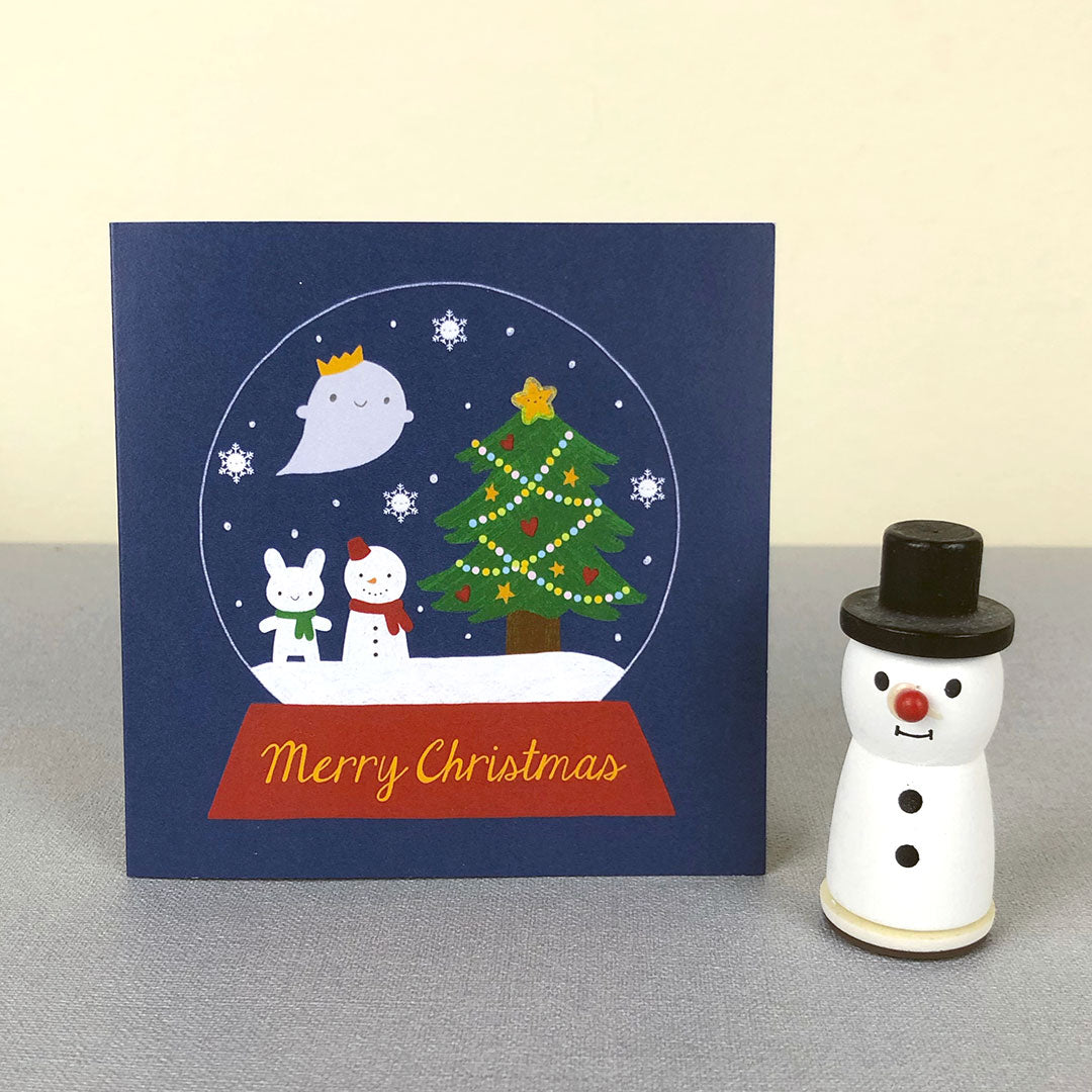 The card standing up with a small snowman figure