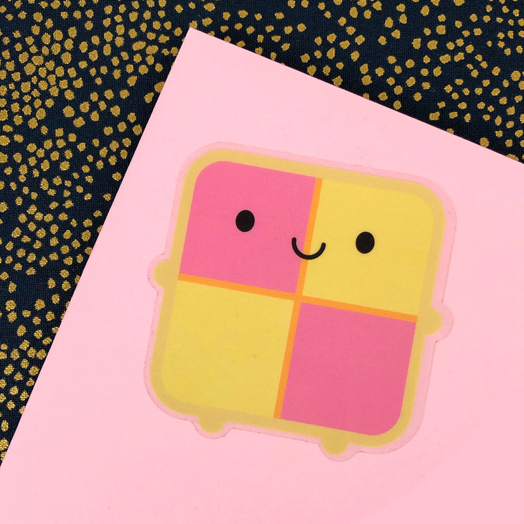 A Battenberg Cake sticker displayed on an envelope to show the clear border