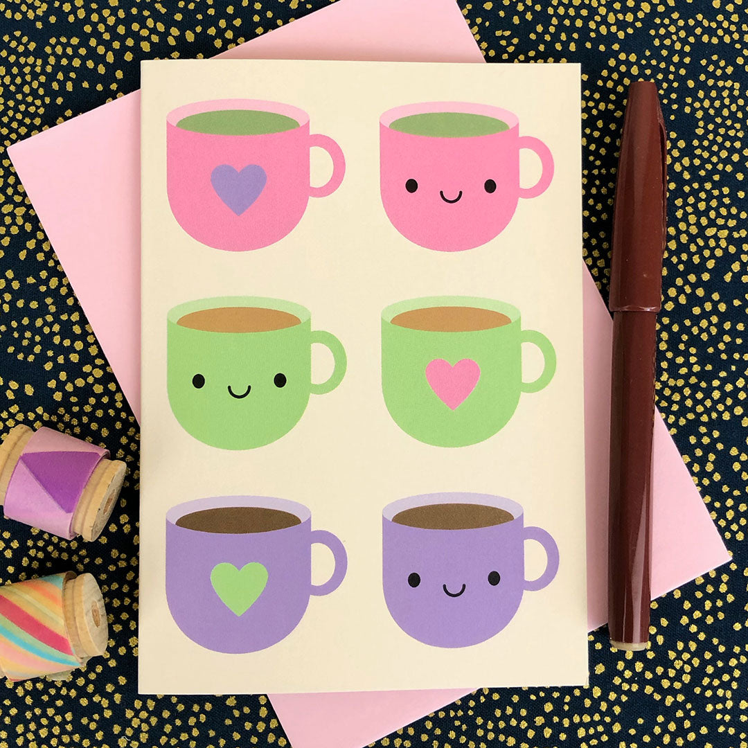An illustrated card with pink, green and purple cups filled with hot drinks