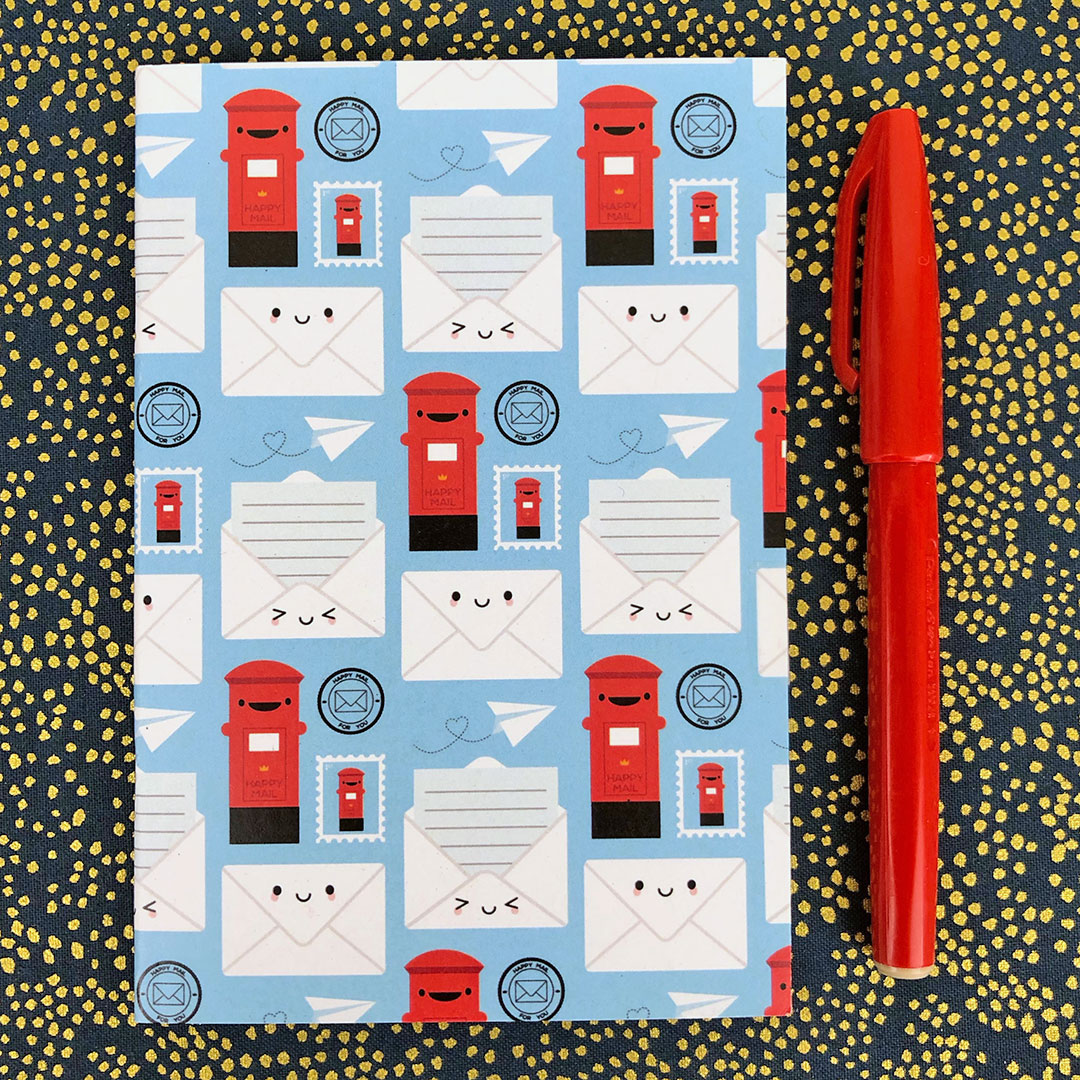 The cover has a repeat pattern of kawaii postboxes, letters, envelopes, stamps, postmarks and paper aeroplanes