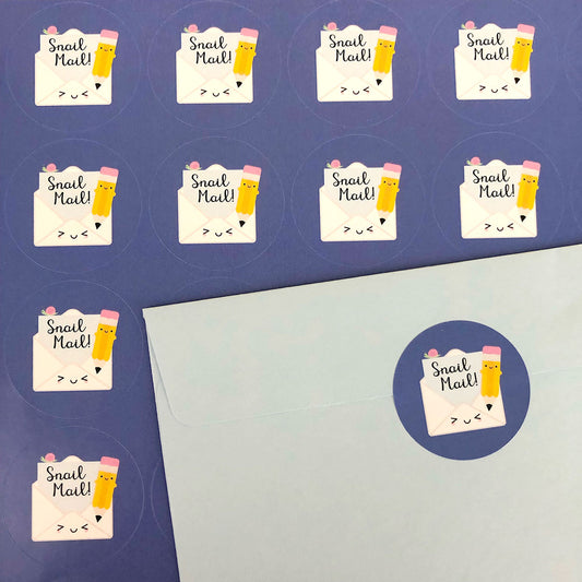 A sheet of Snail Mail stickers plus an envelope sealed with another sticker