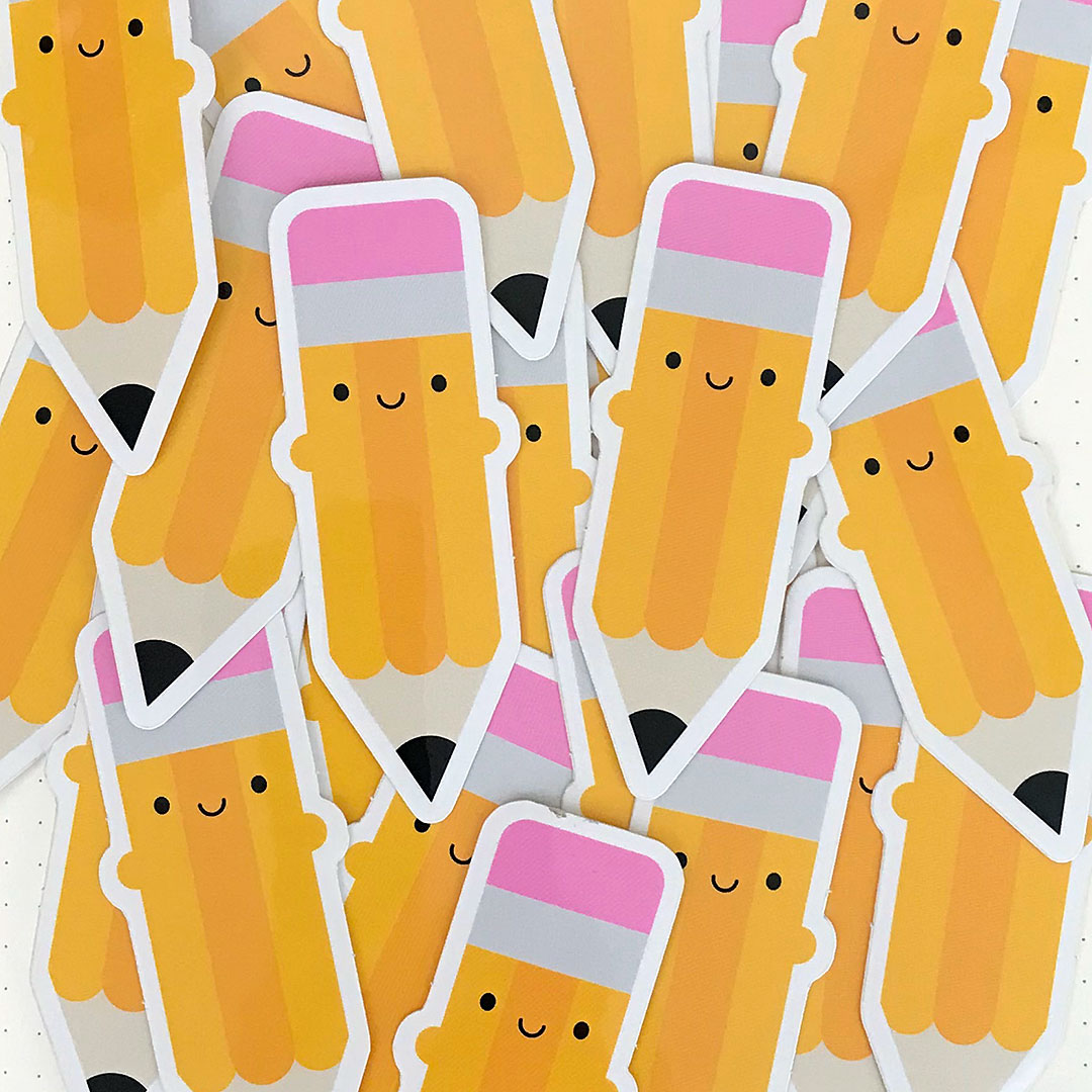 A scattered pile of Pencil vinyl stickers