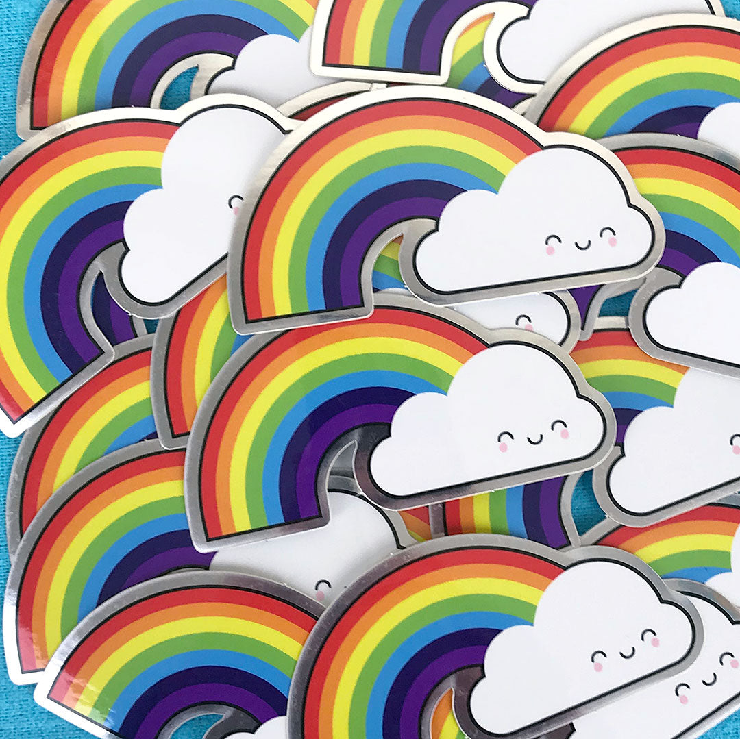 A scattered pile of Rainbow stickers