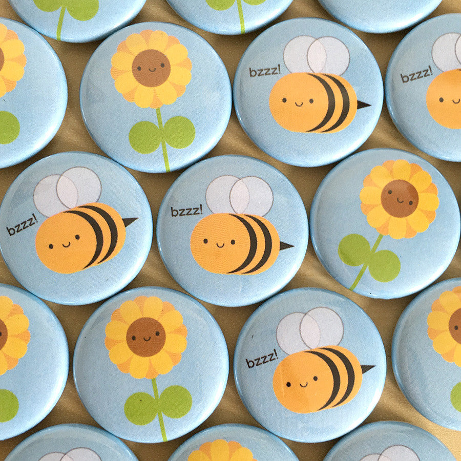 A mix of the finished Sunflower & Bee badges laid out together