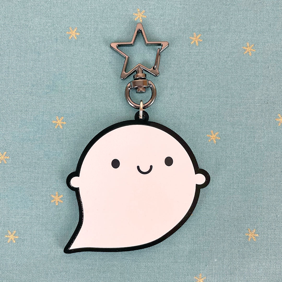 A happy ghost shaped keyring with full colour print and star keychain
