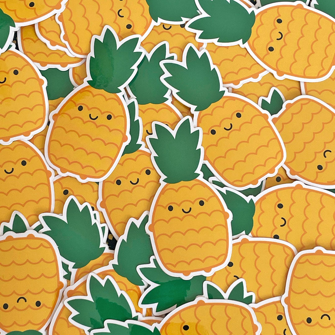 A scattered pile of Pineapple stickers