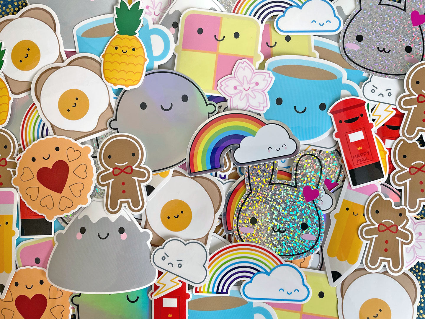A scattered pile of all my kawaii vinyl stickers