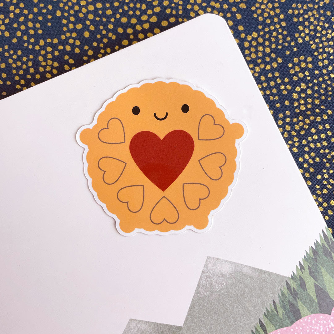 Jammie Dodger vinyl sticker on a notebook