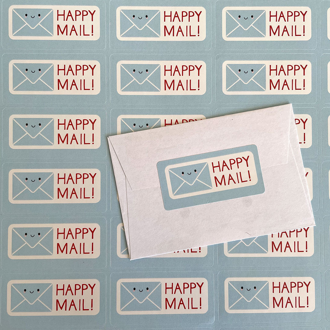 A sheet of Happy Mail stickers and one sealing a mini envelope
