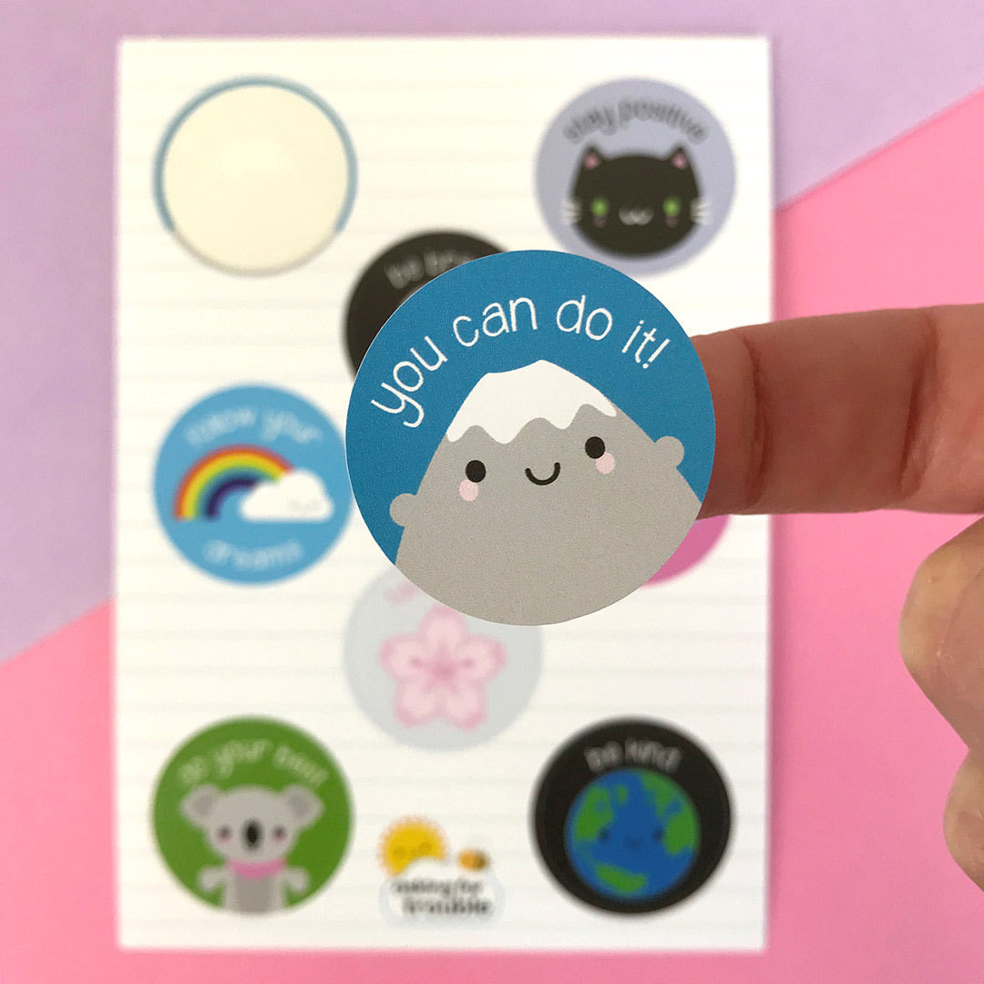 A close up of a die cut 'You Can Do It!' Mt Fuji sticker