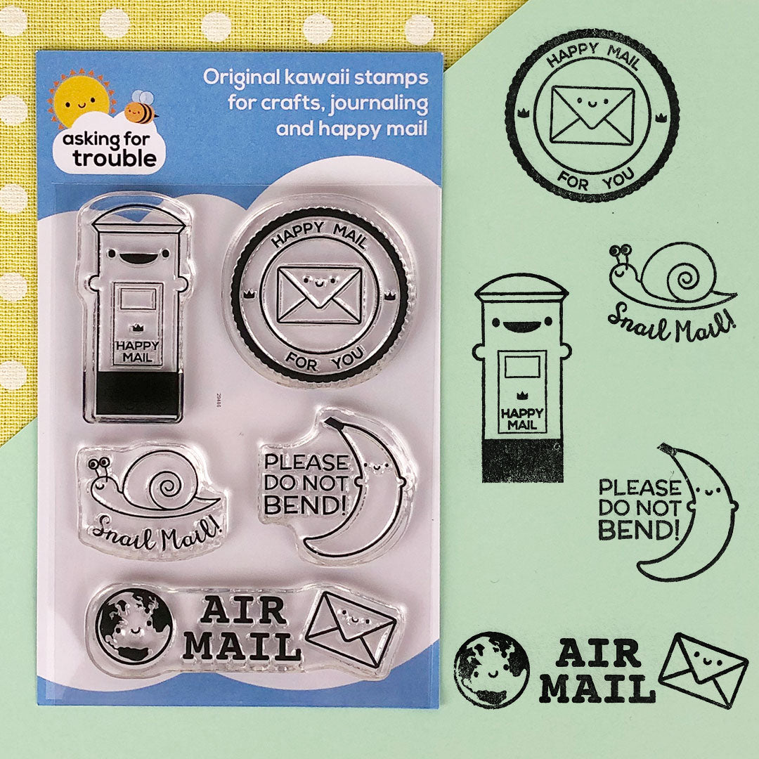 The packaged Happy Mail (original) stamp set and how all 5 designs look when stamped with ink