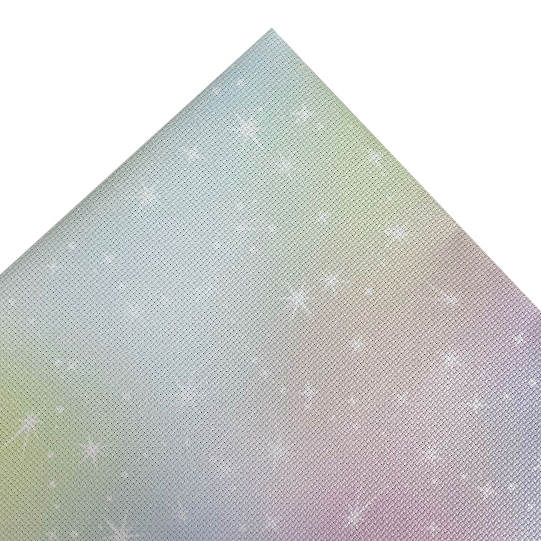 Aida fabric digitally printed with a dreamy wash of pastel colours and white starbursts