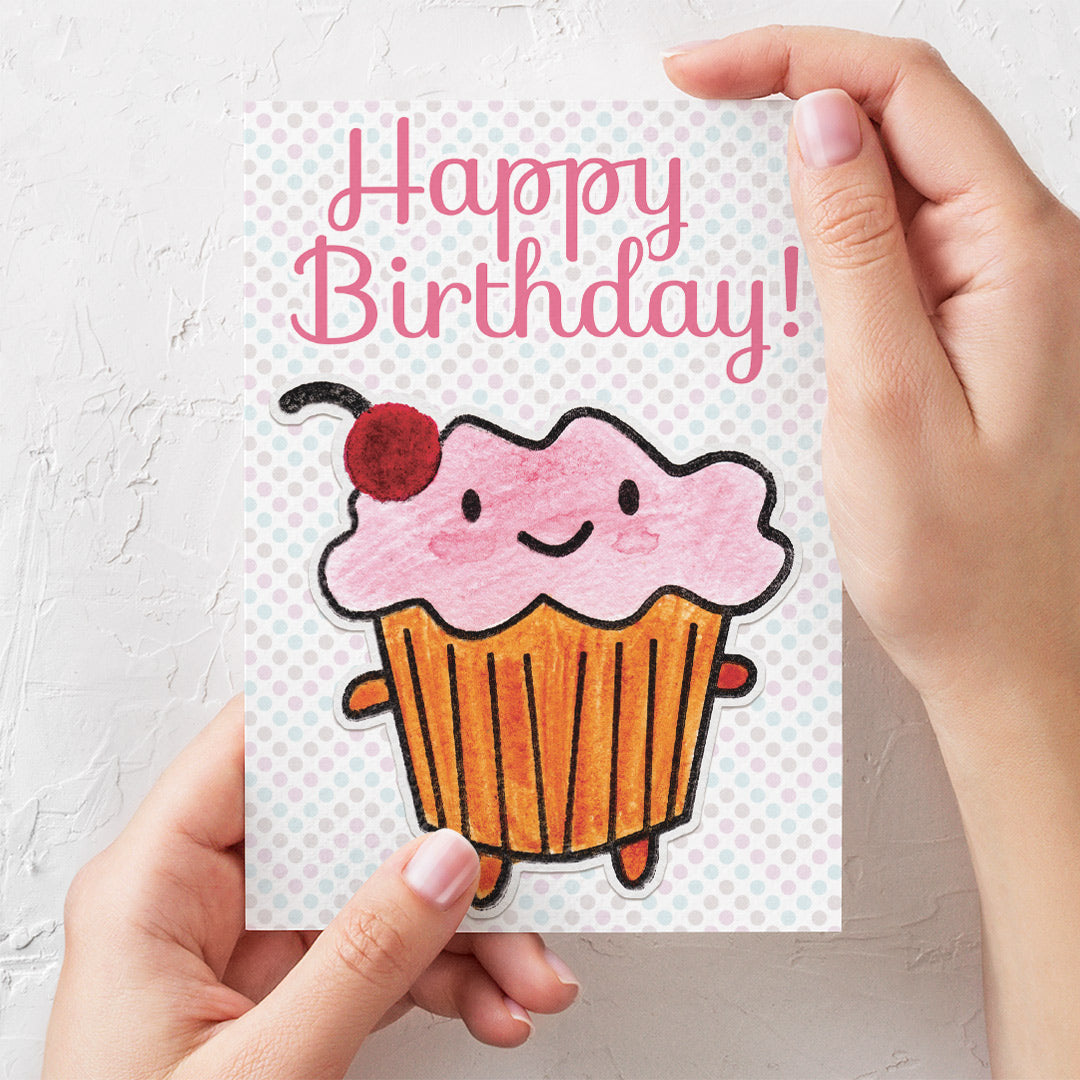 Mockup of cupcake card with hands to show scale (A6)
