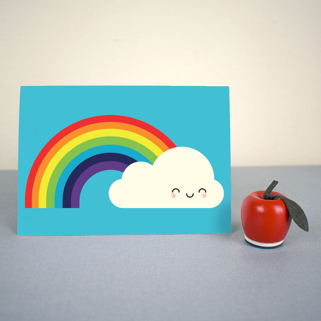 The card standing up with a small apple figure